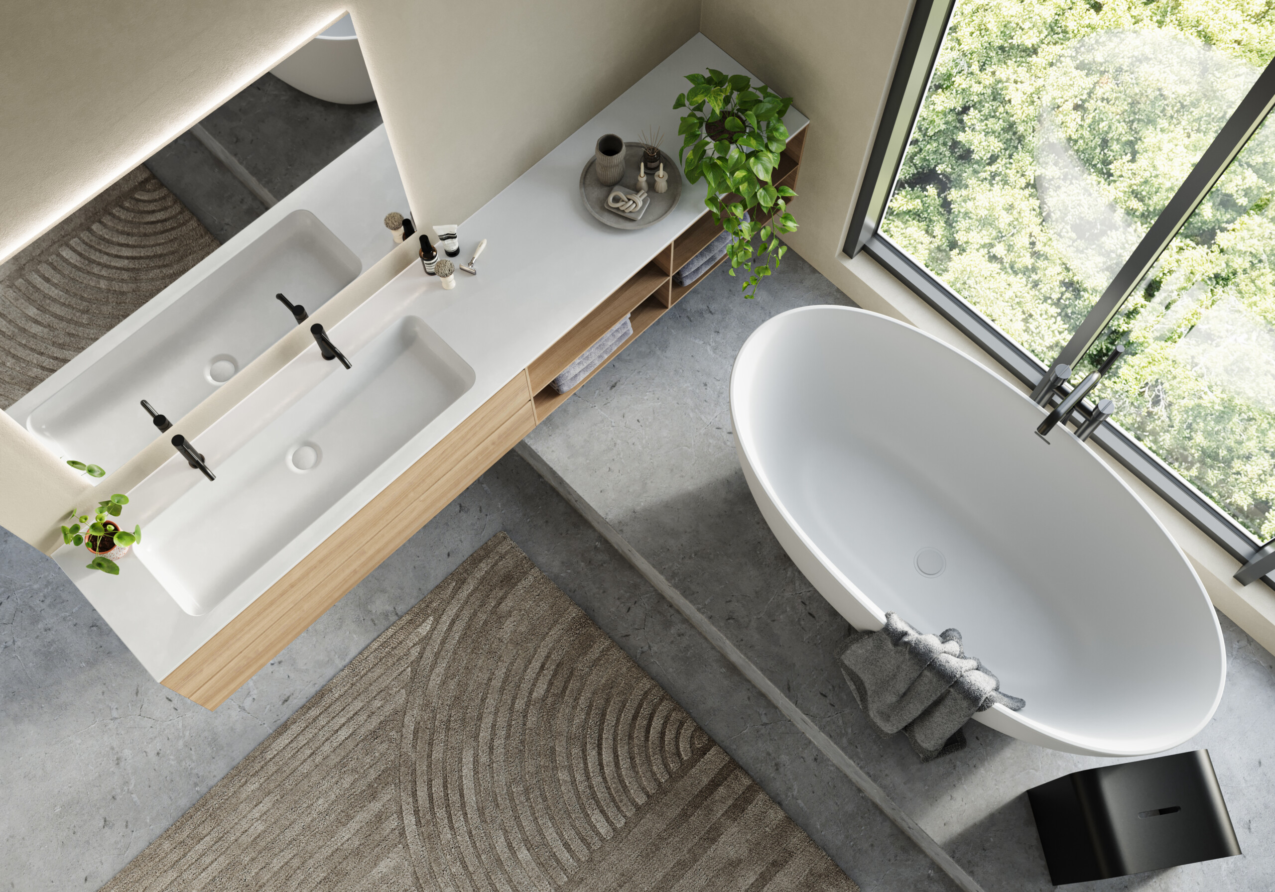 Top view of the Cade Xonyx™ stone bathtub in a bathroom with a Xonyx™ countertop basin