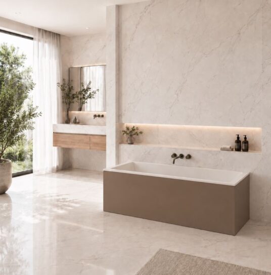 Plano Xonyx™ stone bathtub with mocha panel in a bathroom interior